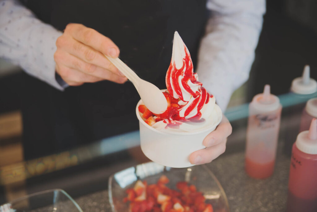 Sampling Fun Fro-Yo flavors at the Wooden Spoon is one of the cool things to do in Wimberley, TX