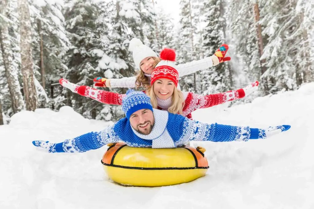 Spending the day snow tubing with the family is one of the fun things to do in New Hampshire in winter