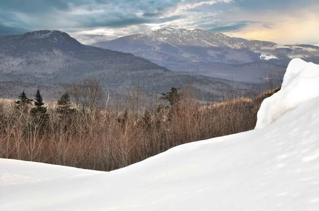 Going on a road trip on the Kancamagus Highway is one of the fun things to do in New Hampshire in winter