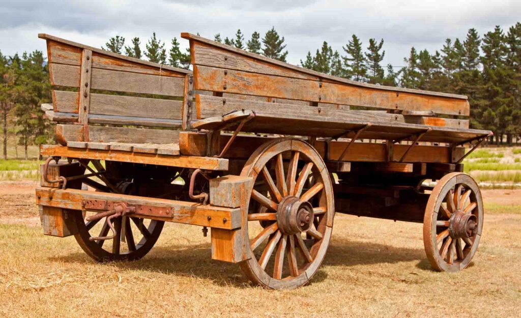 Old wooden wagon standing outside in the sun