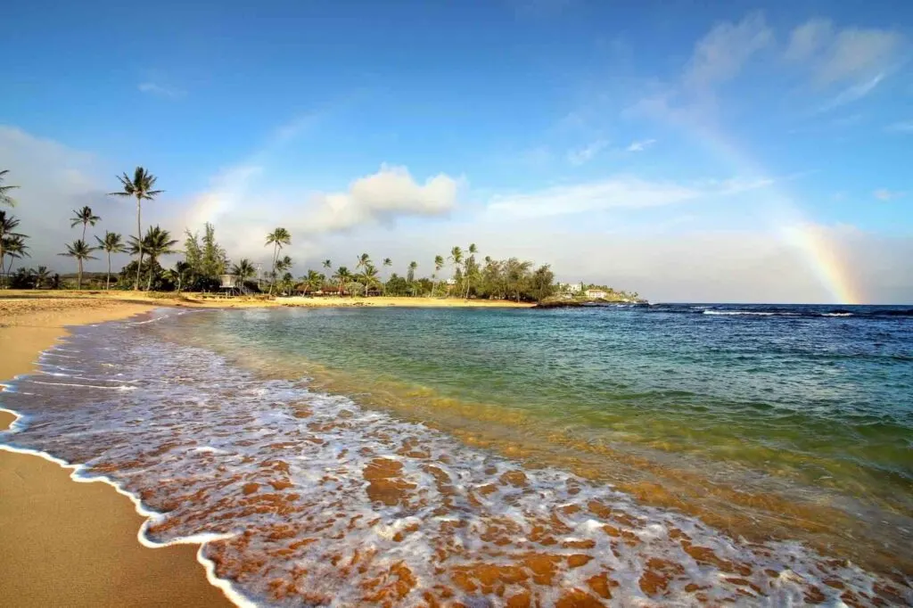 Rainbow on Poipu Beach in Kauai, Hawaii