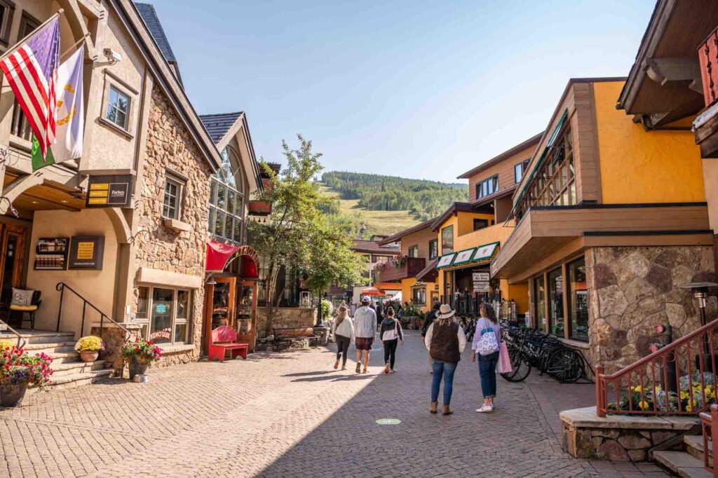 People explore the beautiful mountain village of Vail, Colorado, in summer