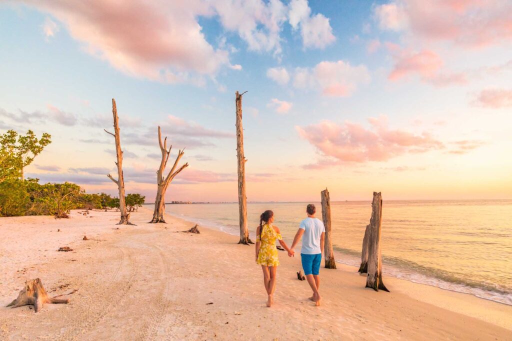 Couple walking along the beach at Lover's Key in Florida