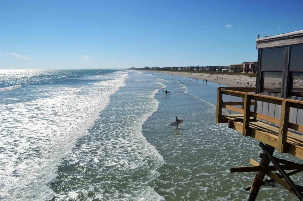 Beach goers and surfers at Cocoa beach in Florida