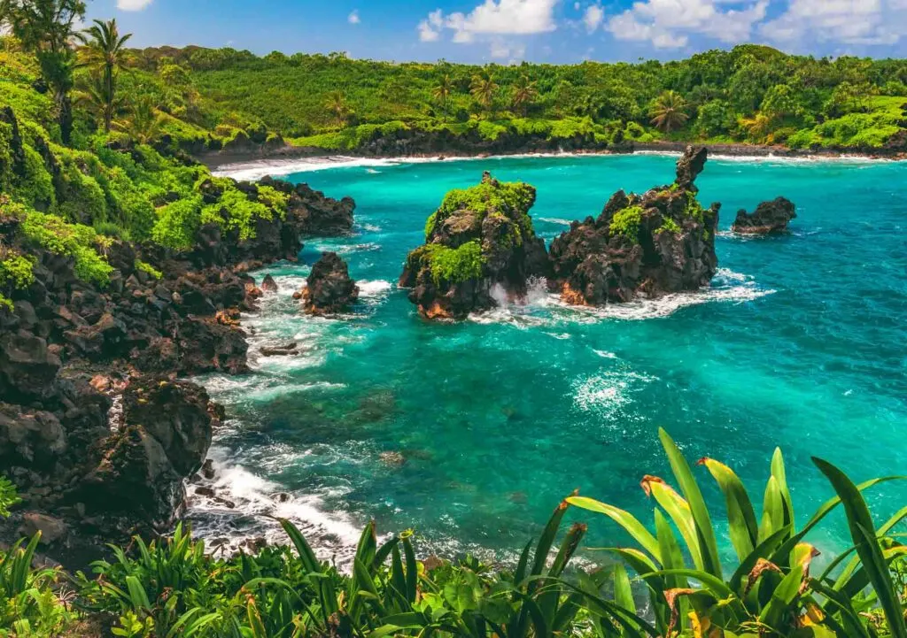 Beautiful turquoise waters of Hana Beach Bay Park in the island of Maui in Hawaii