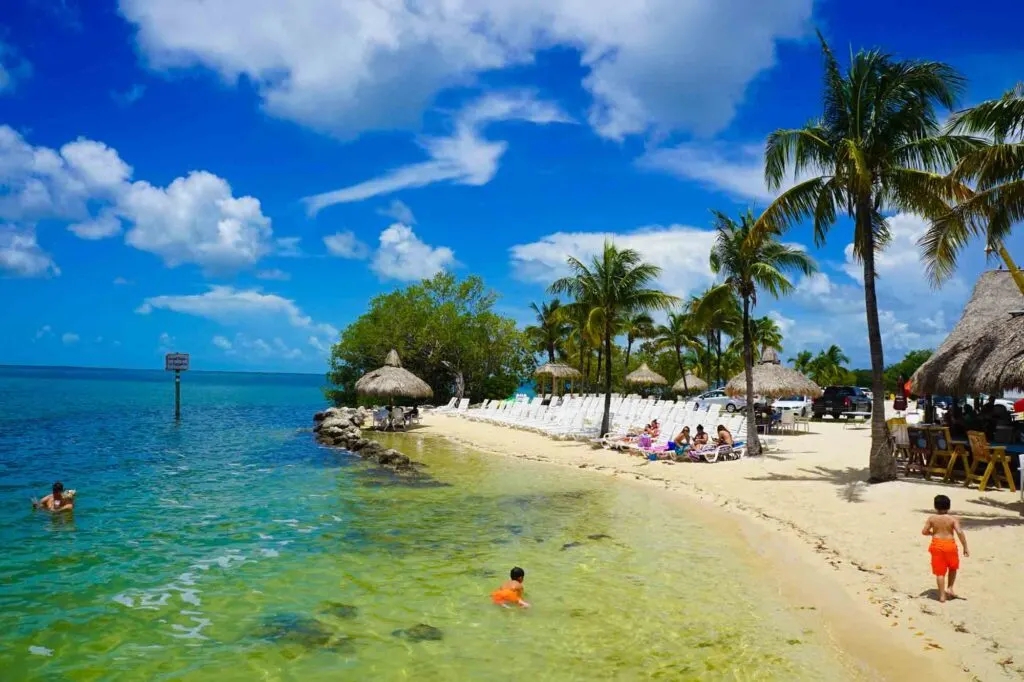 Kids swimming in a beach at Key Largo in Florida