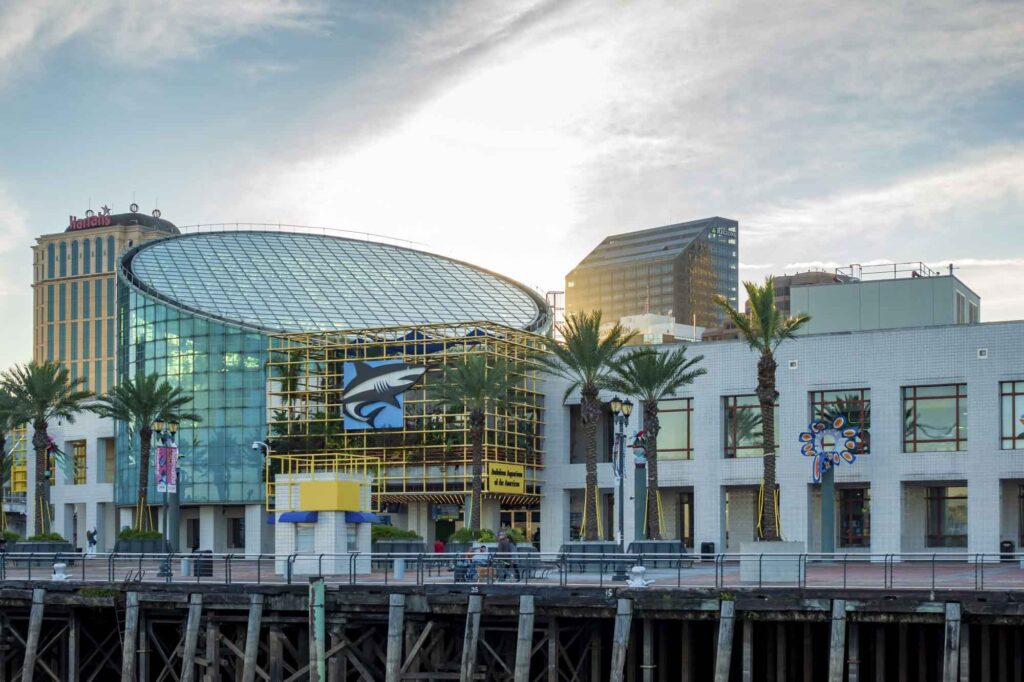 the striking glass and steel building of Audubon Aquarium of the Americas in New Orleans