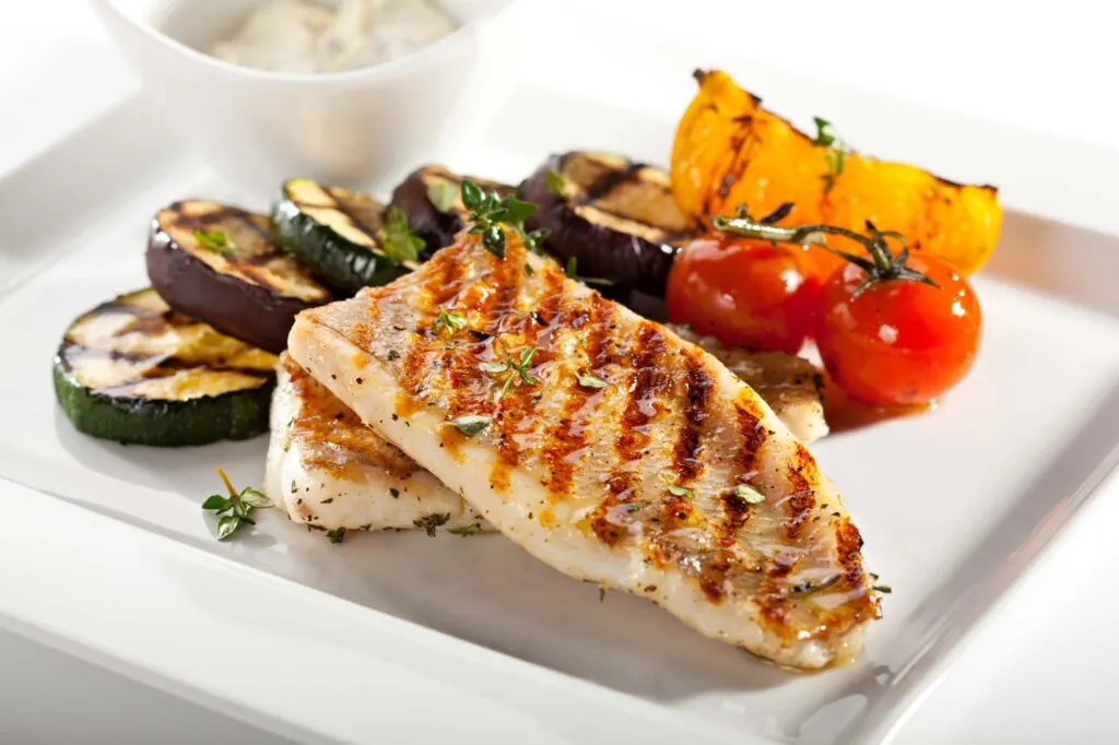 Delicious grilled grouper fillet on a plate