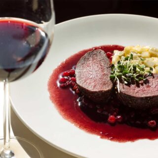 A serving of venison with red wine