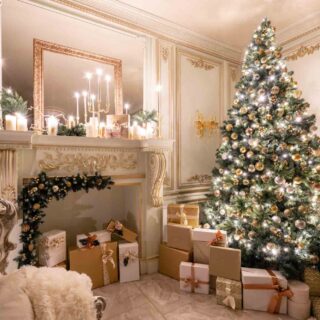 Beautifully lit hall decorated with Christmas tree and presents