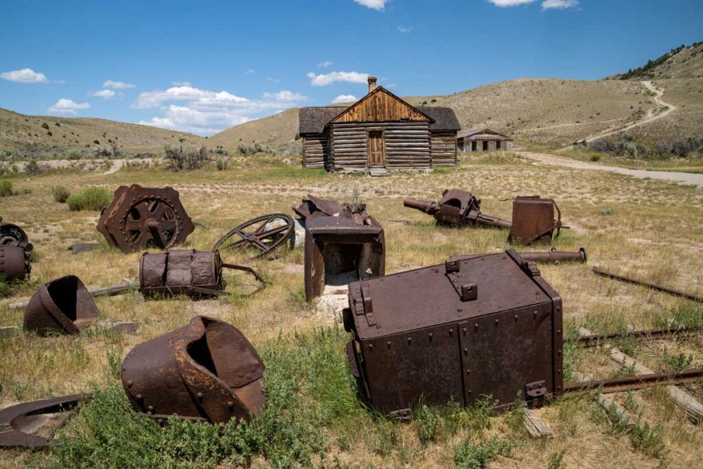 Old mining equipment scattered around in Bannack, Montana