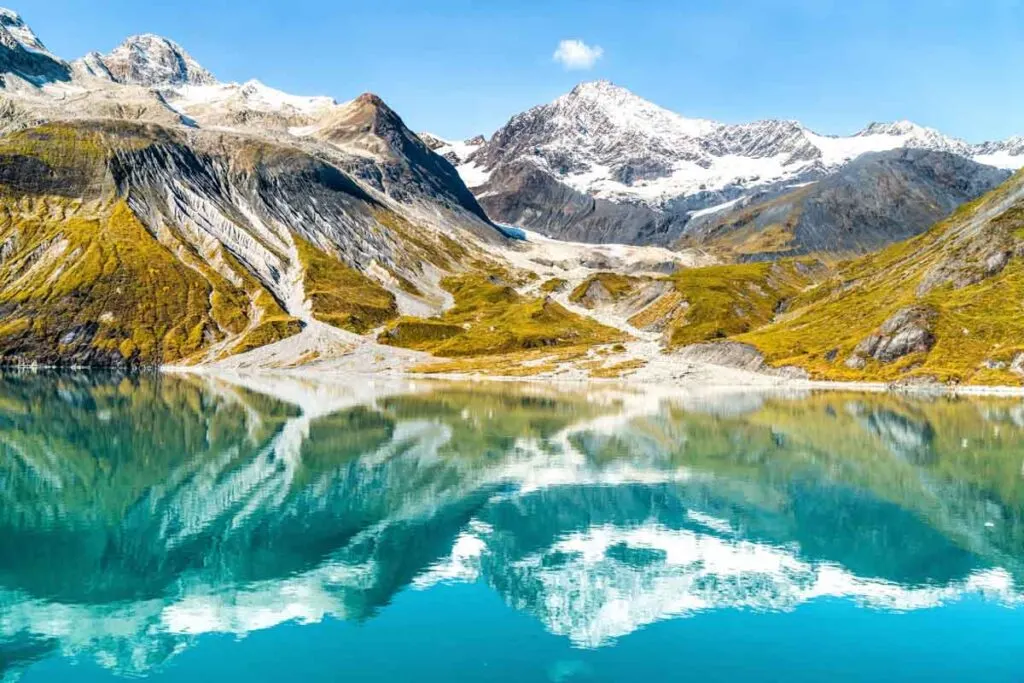 Azure waters of Glacier Bay National Park reflecting the incredible snowy mountains